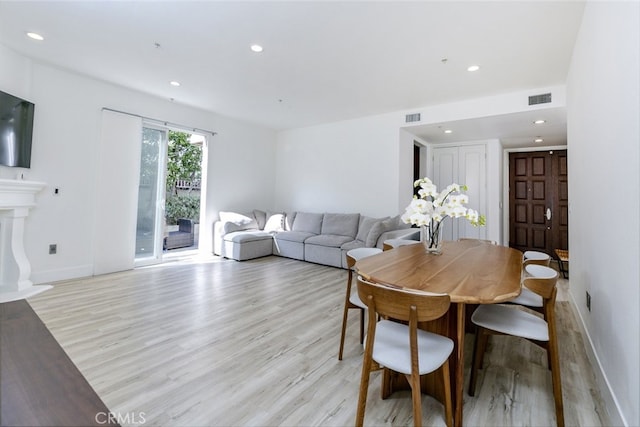 dining space featuring light hardwood / wood-style flooring