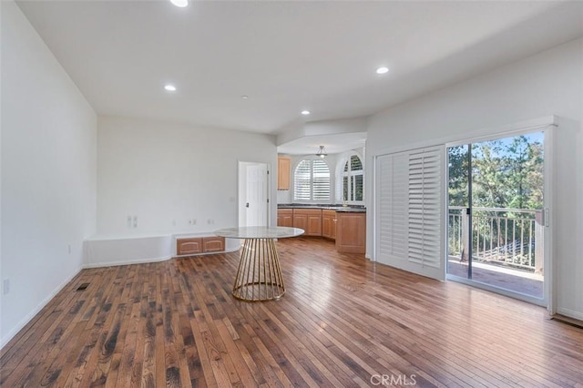 unfurnished living room featuring dark hardwood / wood-style flooring