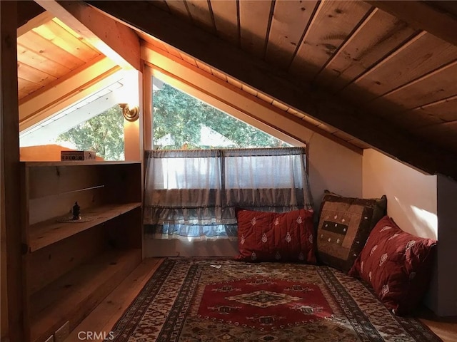 bonus room with vaulted ceiling and wood ceiling