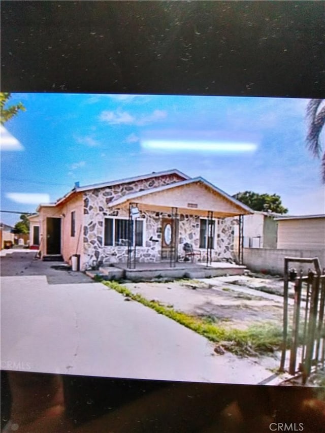 view of front of house with a patio area