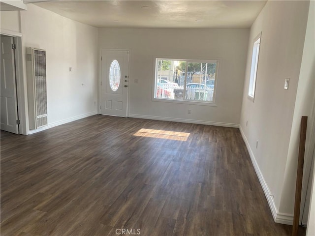 foyer featuring a healthy amount of sunlight and dark wood-type flooring