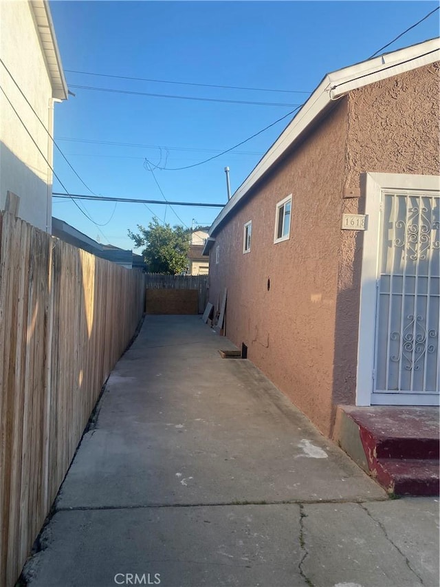 view of side of property featuring a patio