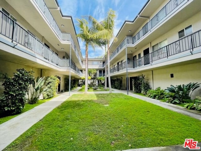 view of home's community featuring a lawn