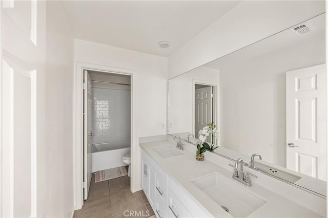 full bathroom featuring tile patterned floors, vanity, toilet, and shower / bathing tub combination