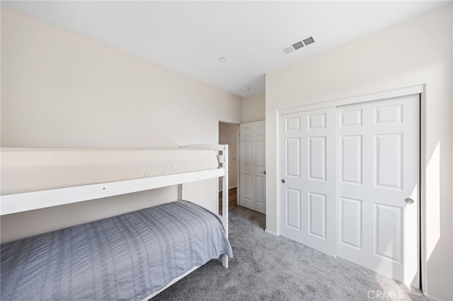 bedroom with carpet floors and a closet