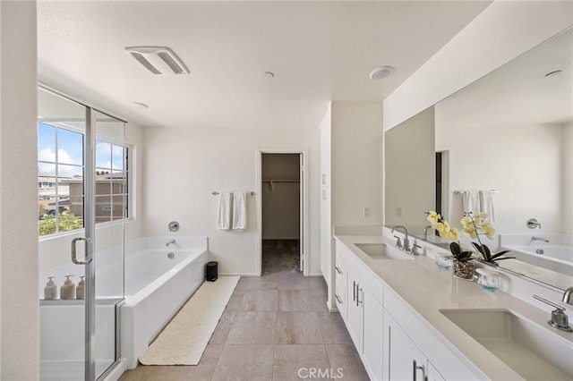 bathroom featuring vanity and plus walk in shower