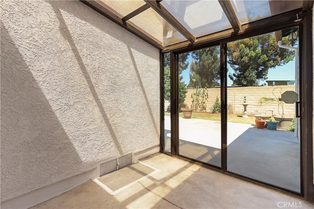 unfurnished sunroom featuring plenty of natural light