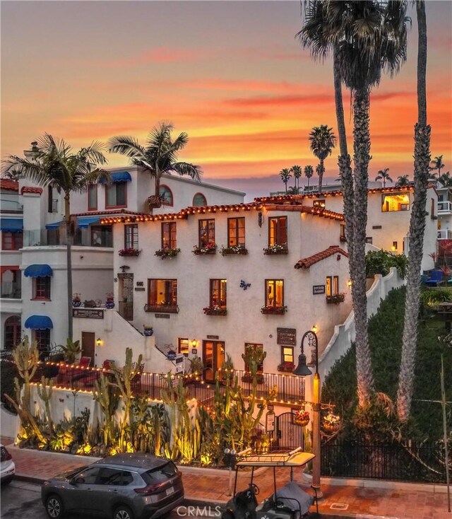 view of outdoor building at dusk