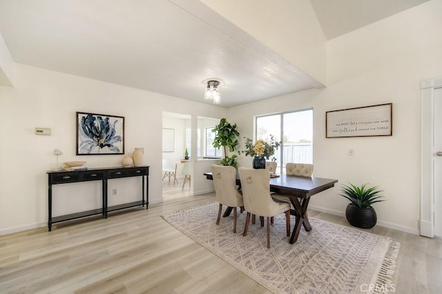 dining space featuring light wood-type flooring