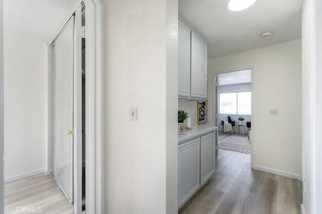 hall featuring light wood-type flooring