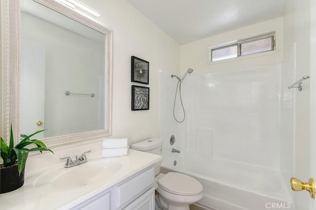 full bathroom featuring bathing tub / shower combination, vanity, and toilet