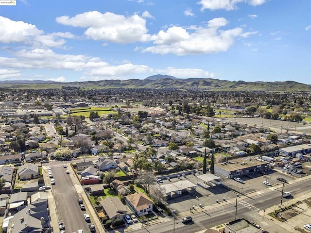 birds eye view of property with a mountain view