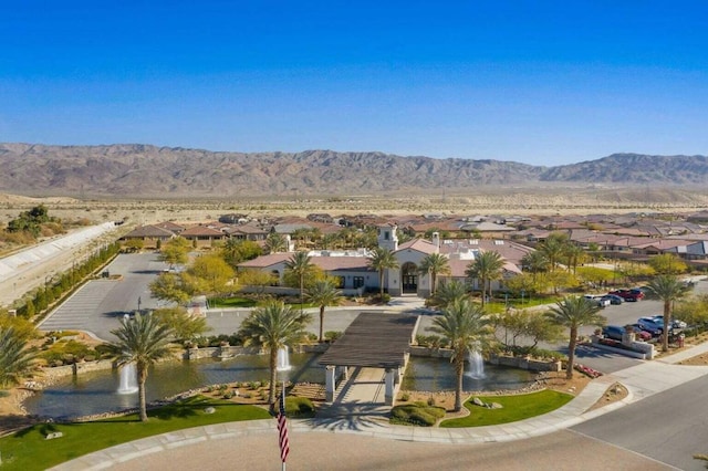 birds eye view of property with a mountain view