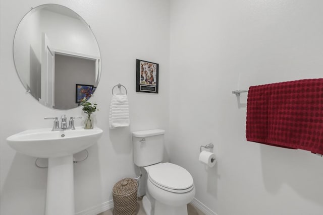 bathroom with sink and toilet