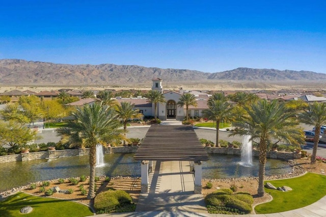 exterior space with a water and mountain view