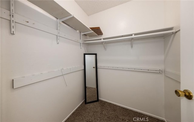 35172 Mesa Grande Dr, Calimesa, CA 92320 - walk in closet featuring dark colored carpet