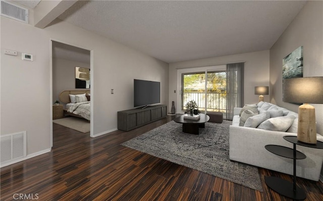 living room with dark hardwood / wood-style flooring