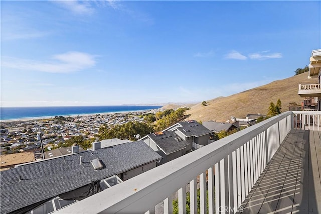 balcony featuring a water view