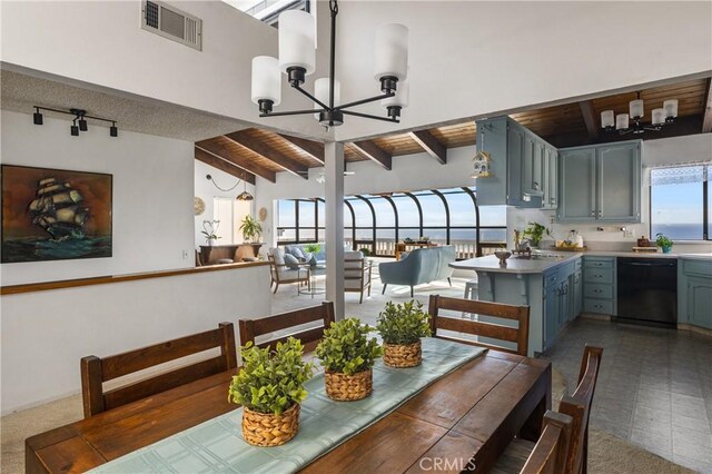 dining room with beamed ceiling, a notable chandelier, and wood ceiling