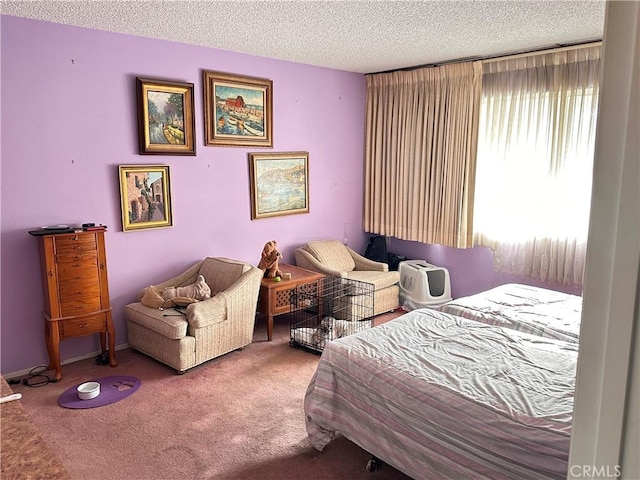 bedroom featuring carpet floors and a textured ceiling