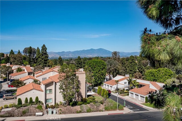 birds eye view of property with a mountain view