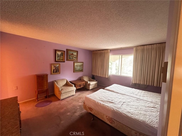 bedroom with carpet and a textured ceiling