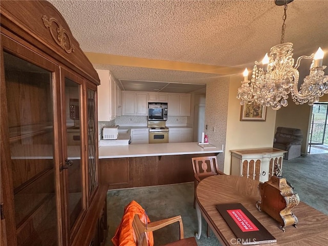 dining area featuring carpet flooring and a textured ceiling