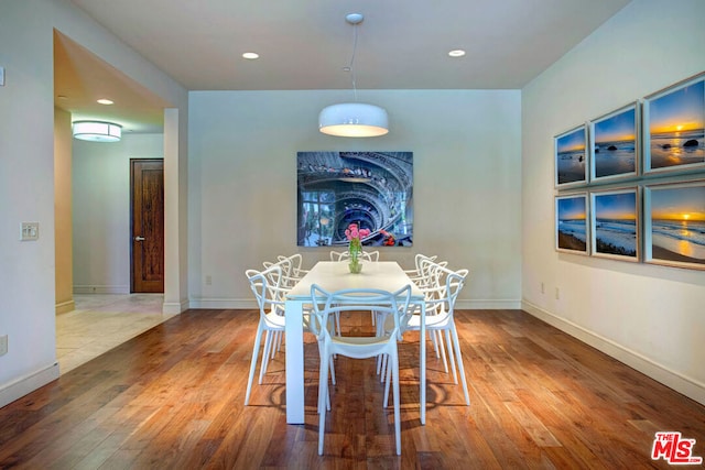 dining area with hardwood / wood-style flooring