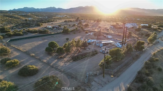 birds eye view of property featuring a mountain view