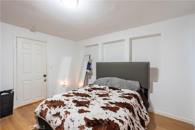 8079 White Rd, Phelan, CA 92371 - bedroom featuring light wood finished floors and baseboards