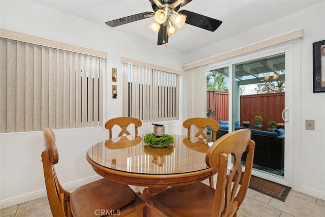 tiled dining room with ceiling fan