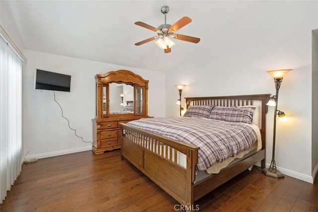 bedroom with ceiling fan, lofted ceiling, and dark hardwood / wood-style flooring