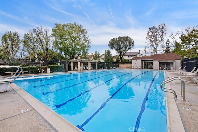 view of swimming pool with a patio