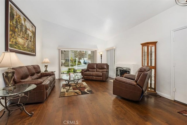 living room with lofted ceiling and hardwood / wood-style floors