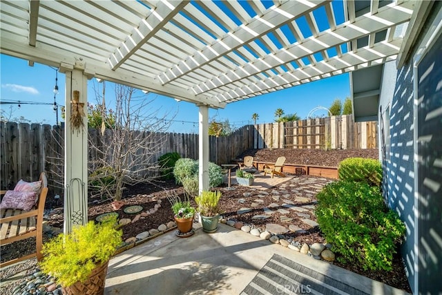 view of patio / terrace featuring an outdoor fire pit, a fenced backyard, and a pergola