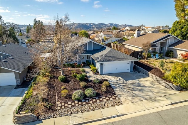 birds eye view of property with a residential view and a mountain view