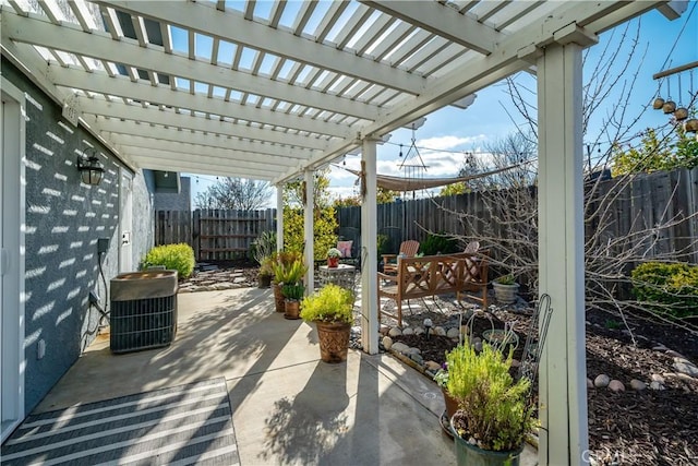 view of patio / terrace featuring central AC unit, outdoor dining area, a fenced backyard, and a pergola