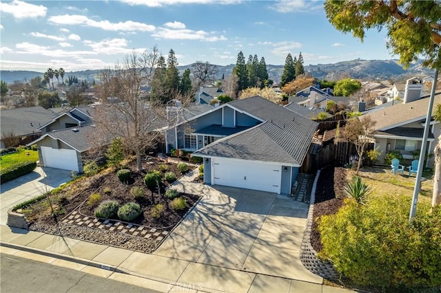 birds eye view of property with a mountain view