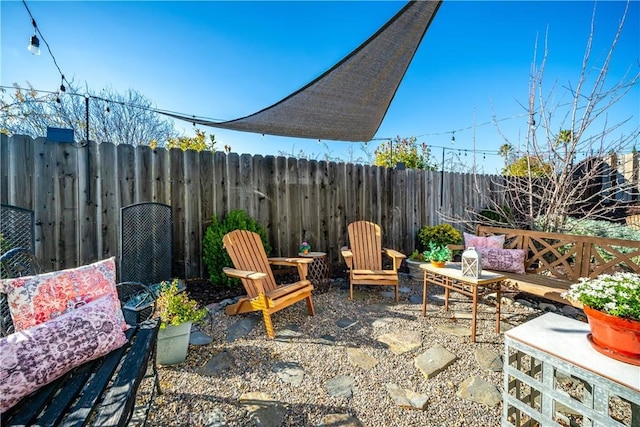 view of patio featuring fence