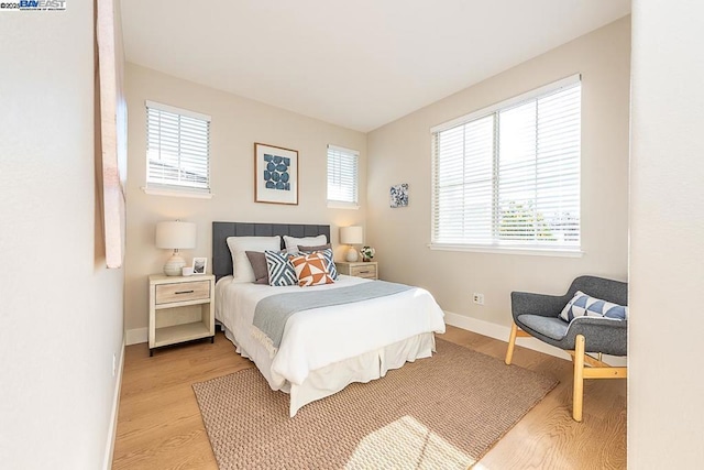 bedroom with light hardwood / wood-style floors