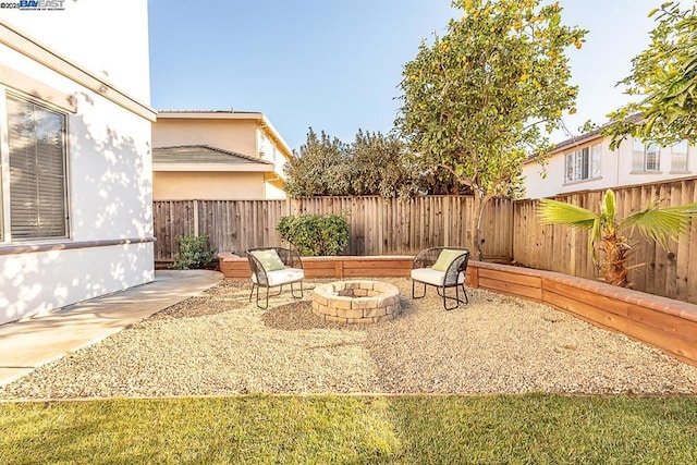 view of patio with an outdoor fire pit