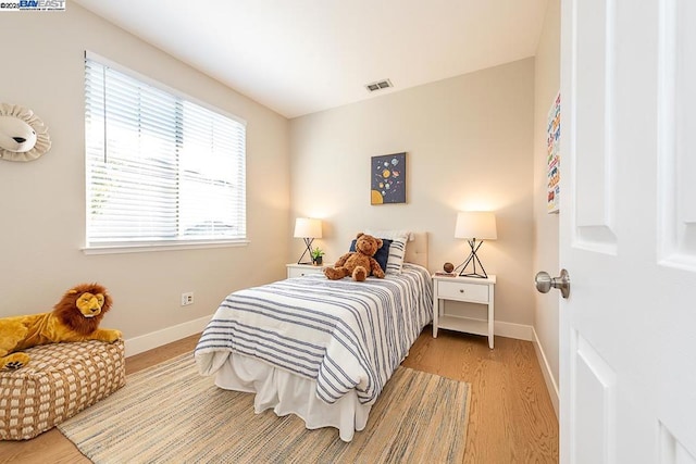 bedroom with light hardwood / wood-style floors