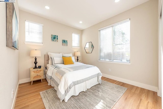 bedroom with light hardwood / wood-style flooring