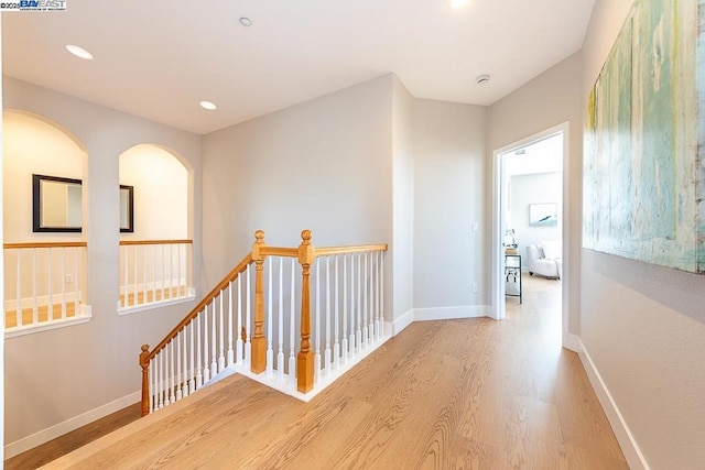 hall with light hardwood / wood-style floors