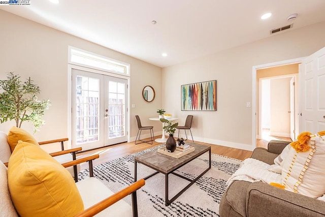 living room featuring hardwood / wood-style floors and french doors