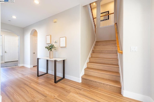 stairway featuring hardwood / wood-style floors