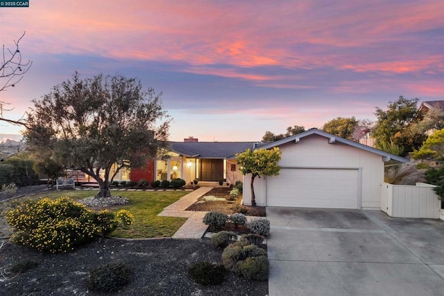 ranch-style house featuring a garage