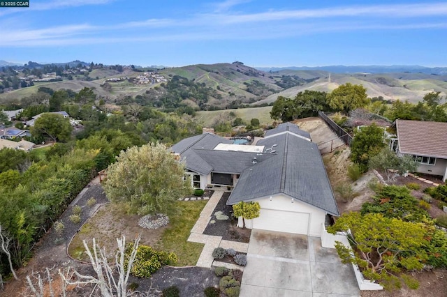 birds eye view of property featuring a mountain view