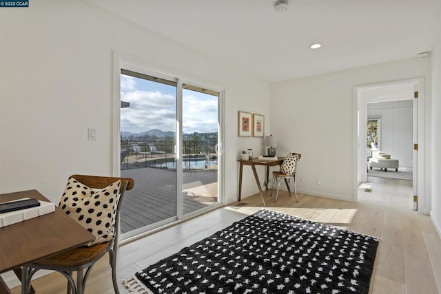 interior space featuring a mountain view and light wood-type flooring