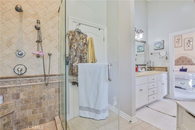 bathroom with vanity, tile patterned floors, and walk in shower